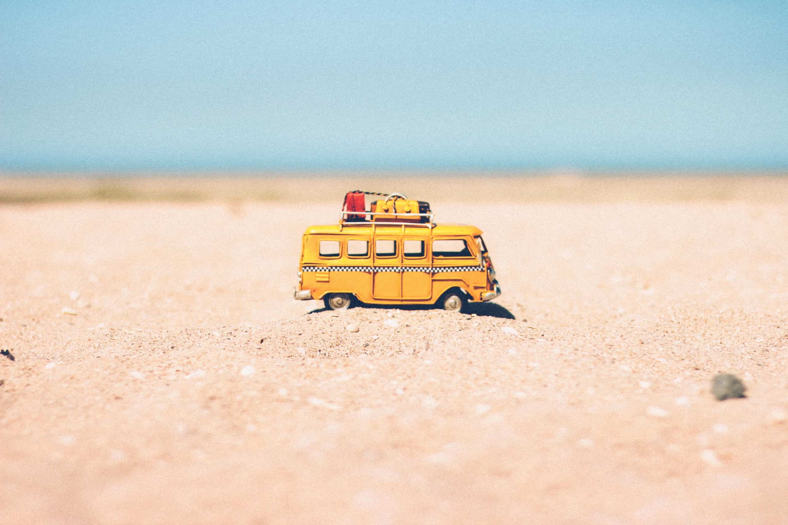 A car on the beach demonstrating Unlimited Holiday Allowance